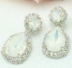 "* A Statement Wedding Jewelry Set in breathtaking Swarovski® Crystal White Opal. Exquisite in elegance and brilliance. * The Top round Posts (or Clip-Ons) are 8.5mm Swarovski® Crystal Xirius Chatons, and the Pear Teardrops are large, brilliant 18mm x 13mm Swarovski® Crystal Passions® fancy Teardrop Stones. * The length of each dangling Bridal Earring is 1 5/8\"(41mm) * Coordinating beautifully with the Bridal Earrings is a gorgeous, adjustable Statement Swarovski Necklace, filled with 32 Crysta White Crystal Rhinestone Teardrop Earrings, Sparkling Pear-shaped Crystal Bridal Earrings, Nickel-free White Crystal Earrings For Wedding, Winter Wedding Jewelry, White Pear-shaped Cubic Zirconia Chandelier Earrings, Statement Wedding Jewelry, Snowy Winter Wedding, Blue Wedding Jewelry, Teardrop Bridal Earrings