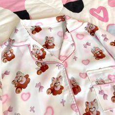 This adorable pajama set is perfect for a cozy night in! Featuring a charming print of hearts,red pandas, and crosses, this set is both cute and comfortable. The top is designed with a button-up front and includes a convenient pocket on one side of the chest. The pants boast an elastic waistband, ensuring a snug yet flexible fit.  Please note that the price includes one pajama set only.   	 		 			Top Size 			S 			M 			L 		 		 			Length 			62 			63.5 			65 		 		 			Bust 			103 			107 			111 Cute Printed Tops For Pajama Party, Cute Red Pajama Party Sets, Cute Printed Sleepwear, Cute Printed Sleepwear For Pajama Party, Cute Red Sleepwear For Loungewear, Cute Long Sleeve Sleepwear, Playful Red Sleepwear For Pajama Party, Cute Red Sleepwear For Bedtime, Red Cartoon Print Sleepwear For Sleepover