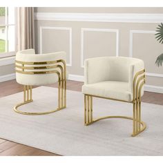 two white chairs with gold trim on them in front of a beige carpeted room