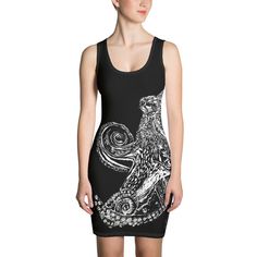 a woman wearing a black and white dress with an owl on it