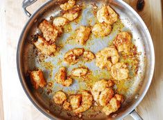 some food is cooking in a pan on the table