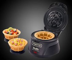 the waffle maker has two bowls of fruit in it and is ready to be eaten