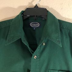 Mens River’s End Short Sleeve Shirt. Button Down. Button Down Pointed Collar. Pocket With Pencil Holder. Soft Cotton. Generous Fit. Size Small 100% Cotton Machine Wash Cold Length - 31” Shoulder To Shoulder - 20” Armpit To Armpit - 23” Sleeve - 9 1/2” Waist - 23” Color - Evergreen Casual Green Dress Shirt For Work, Vintage Shirt With Casual Collar And Buttons, Green Business Casual Tops With Buttons, Green Cotton Business Casual Shirt, Green Cotton Shirt For Business Casual, Green Button Closure Top For Business Casual, Green Buttoned Tops For Business Casual, Casual Green Cotton Dress Shirt, Green Shirt With Button Closure And Spread Collar