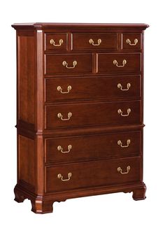 a wooden dresser with four drawers and brass pulls on the bottom drawer, against a white background