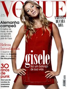 a woman in a red dress is on the cover of a magazine with her hands on her hips