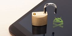 an open padlock on top of a tablet with a green skull and crossbone sticker