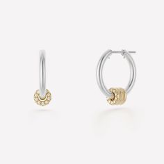 The Ara Deux Hoop Earrings are the definition of a luxurious, elevated staple. Comprised of medium-sized, tubular hoops in either .925 sterling silver or 18k yellow gold anchored by pure 18k white gold posts, the Ara Deux Hoop Earrings feature three floating annulets of 18k yellow gold. The outermost annulet is adorned by contrasting, front-facing, pave-set white diamonds. Luxury White Gold Small Hoop Earrings, White Gold Small Hoop Earrings For Everyday Luxury, Luxury White Gold Hoop Earrings Tarnish Resistant, Modern White Gold Small Hoop Diamond Earrings, Sterling Silver Hoop Earrings For Everyday Luxury, Timeless Hoop Earrings With Spring Ring Clasp, Yellow Gold Sterling Silver Hoop Earrings For Everyday, Tarnish Resistant Hoop Diamond Earrings In White Gold, Everyday Luxury Small Hoop Earrings In White Gold