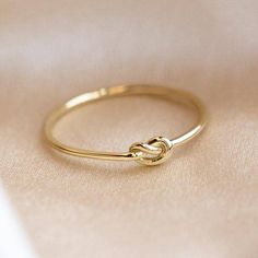 10K Solid Gold Love Knot Ring Stacking Dainty Minimalist Knuckle Band Light Weighted Simple Forget Me Knot Ring Handmade Friendship Ring This awesome ring features studded gold ring this style and charm available in thirty six sizes. The unique pattern in and geometric shape of sank make the ring so dainty and minimalist that you can wear it every day. A perfect gift for Valentine's Day anniversaries, birthdays, and graduations, this piece is so cute and sophisticated that you would like to wear Gold Rings Without Stones For Women, Elizabeth Stone, Gold Knot Ring, Friendship Ring, Love Knot Ring, Local Eclectic, Golden Design, Knot Tie, Gold Rings Simple