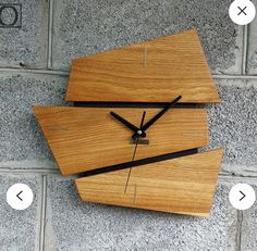 a clock made out of wood on the side of a wall