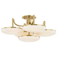 three light brass ceiling fixture with white glass shades