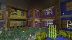 an image of a house in the minecraft style with trees and bushes around it