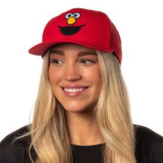 This Sesame Street hat is the ultimate accessory for the young or the young at heart. This bright red hat features a great embroidered Elmo face on the crown, with a pre-curved brim and an adjustable snapback, ensuring a great fit for heads of all sizes. The sturdy yet lightweight construction makes it ideal for daily wear, outdoor adventures, or showcasing your Elmo admiration at themed events and parties. This snapback hat is a distinctive collector's item for Sesame Street enthusiasts. Fun Flat Brim Baseball Cap One Size Fits Most, Fun Flat Brim Baseball Cap One Size, Fun Style Baseball Cap With Flat Bill, Fun Style Flat Bill Baseball Cap, Fun Style Adjustable Flat Bill Baseball Cap, Fun Flat Brim Baseball Cap, One Size Fits Most, Fun Baseball Cap With Flat Bill, Red Hats With Embroidered Logo One Size Fits Most, Novelty Baseball Cap With Flat Bill And Adjustable Fit