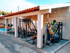 an outdoor gym area with various equipment on display