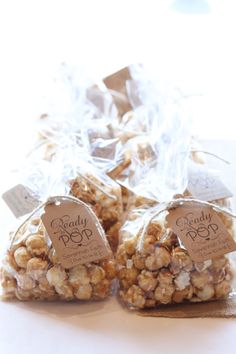 three bags of popcorn sitting on top of a table