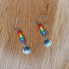 Happy Face Pride Rainbow Dangle Earrings Handmade By Me Glass Seed Beads Silvetone Charms Stainless Steel Earring Hooks 1 7/8" Drop New Fun Dangling Beads Jewelry As Gift, Fun Dangling Beads Jewelry For Gifts, Fun Jewelry With Dangling Beads For Gift, Nickel Free Rainbow Beaded Earrings For Gifts, Fun Dangle Beaded Earrings With Ear Wire, Cute Multicolor Beaded Dangle Earrings, Handmade Turquoise Earrings, White Tassel Earrings, Blue Tassel Earrings