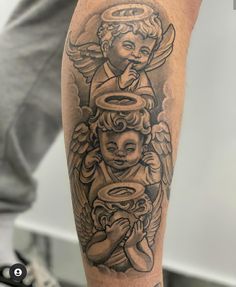 a man's arm with an angel and cup tattoo on the left side of his leg