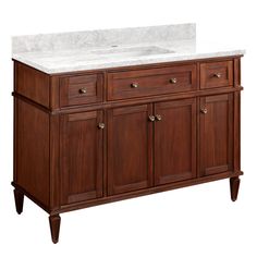 a bathroom vanity with white marble top and wooden cabinetry on the bottom, against a white background