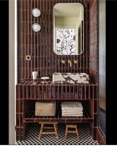 a bathroom with a mirror, sink and shelf in it's centerpieces