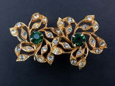 Discover exquisite rhinestone flower earrings - non-pierced and hassle-free. These large, opulent gold floral stud earrings are designed for ultimate elegance with their easy clip-on feature. Adorned with vibrant green crystals and secure screw-on backs, they're the perfect choice for adding a touch of luxury to any occasion. Gift yourself or a loved one these fancy party jewels today. ❗️ Details: Vintage from the 1960s Length: 1 Inches; Width: 1 Inches Materials: gold tone costume jewelry metal, crystal Location: Earlobe Closure: Clip-on Style: Mid-century 3CL And if you happen to be a gentleman shopping for a gift for your lady, here's a couple of tips: 1) There's no such thing as "too much jewelry". 2) Any woman would love jewelry as a gift regardless of her age - and yes, that includes Luxury Clip-on Flower Earrings As Gift, Luxury Clip-on Flower Earrings For Gift, Luxury Clip-on Elegant Flower Earrings, Real Pearl Jewellery, Earrings Fancy, Handmade Boho Jewelry, Floral Studs, Rhinestone Flower, Fancy Party