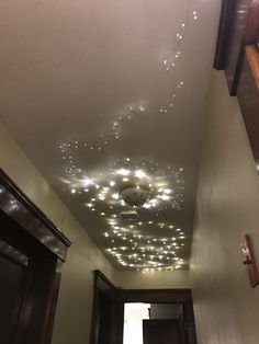 the ceiling is decorated with lights and stars