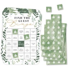 a green and white board game with leaves on it, next to four pieces of paper