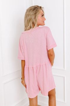 - Keep all eyes on your effortless style with this adorable romper! Short rolled sleeves and buttoned bodice is the epitome of summer charm. Whether you're strolling along the beach boardwalk or enjoying a rooftop brunch with friends, this versatile piece exudes casual elegance. Its playful silhouette offers a perfect balance between comfort and style, making it a must-have addition to your warm-weather wardrobe. Embrace the carefree spirit of the season in this irresistible ensemble - Unlined s Summer Pink Jumpsuits And Rompers For Loungewear, Pink Relaxed Fit Jumpsuit For Loungewear, Summer Pink Short Sleeve Jumpsuit, Pink Short Sleeve Summer Jumpsuit, Pink Short Sleeve Jumpsuits And Rompers For Beach, Pink Short Sleeve Jumpsuit For Beach, Rooftop Brunch, Beach Boardwalk, Comfy Chic