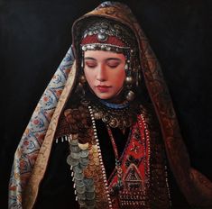 a painting of a woman with her eyes closed and head covered in jewelry, wearing an elaborate headdress