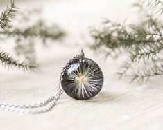 I don't want you to see a simple pendant in this real dandelion wish necklace. In my real dandelion wish necklace, there's a universe of feelings and emotions ✨✨ If you want to know what they are, come with me:   In a sphere of 0.78 inches in diameter, I encapsulated this beautiful dandelion to create this nature jewelry necklace, which could be a unique Christmas gift idea for a woman, adorning the neck of the woman you love. The resin is eco-friendly and natural, giving this real dandelion wis Wish Necklace, Dandelion Necklace, Simple Pendant, Dandelion Wish, Necklace Resin, Dandelion Flower, Necklace Unique, Unique Christmas Gifts, Nature Jewelry