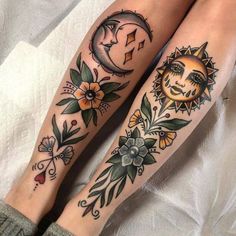 two sun and moon tattoos on both legs, one with flowers in the foreground