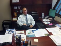 a man sitting at his desk in an office