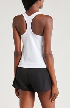 A built-in shelf-bra keeps you supported in this racerback tank top cut with signature Dri-FIT technology for cool, dry comfort as you work up a sweat. 20 1/2" length (size medium) Scoop neck Racerback Built-in shelf-bra Dri-FIT moisture-wicking technology 82% polyester, 18% spandex Machine wash, line dry Imported