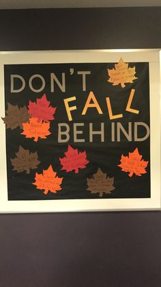 a sign that says don't fall behind with autumn leaves on it and the words, don't fall behind