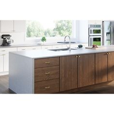 a kitchen with white counter tops and wooden cabinets