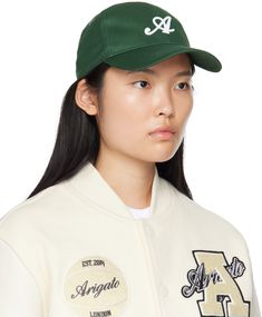 Cotton twill cap in off-white. · Curved brim · Logo embroidered at face · Embroidered eyelet vents at crown · Cinch fastening at back Supplier color: Ecru Axel Arigato, Logo Embroidered, Cotton Twill, Crown, Off White, White, Color