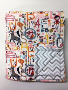 an image of a quilted blanket with numbers and animals on it's side