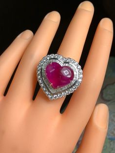 BRAND-NEW!! ONE OF A KIND, HANDCRAFTED RING. ENORMOUS & ELEGANT, 13.59 total carats weight, Certified, GORGEOUS, BURMESE RED RUBY ring. This ring offers an important statement of who you are with a GIGANTIC 10.82 carats, VIVID RED, Nearly TRANSPARENT, BURMESE RUBY. Accentuating the RUBY are the 82 E/VVS, and sparkling natural diamonds THE ITEM YOU SEE IN THE PICTURES IS THE EXACT ITEM YOU WILL GET! ONE OF A KIND, NO DUPLICATES OR TWINS SUGGESTED RETAIL VALUE: $32,500 RUBY: Weight: 10.82 cara Heart Cut Diamond Ring, Huge Diamond Rings, Red Ruby Ring, Gold Ring Engagement, Burmese Ruby, Art Deco Diamond Rings, Ladies Diamond Rings, Handcrafted Rings, White Gold Engagement Rings