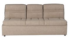 a beige couch with three pillows on it