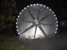 a large metal object sitting in the grass