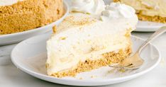 a piece of cake on a plate with a fork next to it and another pie in the background