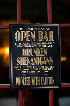 this sign is posted on the door to an open bar