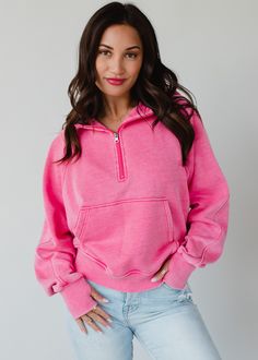 The sweatshirt you'll be living in all year long! Our new comfy bright pink hooded sweatshirt is there perfect option for casual wear.  Bright pink hooded sweatshirt Quarter zipper closure on the front Long sleeves with thumbholes Front kangaroo pocket Slightly cropped hemline Model is wearing a size small  Designed in the U.S.A. Produced in China.  60% Cotton / 40% Polyester Blouses Vintage, Flannel Sweatshirt, Colorful Sweatshirt, Cozy Fabric, Skirt Style, Fuchsia Color, Top Graphic Tees, Quarter Zip Pullover, Pink Sweatshirt