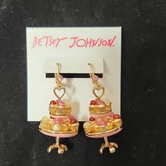 Nwt Betsey Johnson Cup Cake Stand Dangle Earrings. These Earrings Are In New Condition With No Signs Of Wear. Approx. Measurements In Pics. I Accept All Reasonable Offers! Pink Drop Earrings For Birthday, Pink Jewelry With Matching Earrings For Birthday, Sweet Pink Dangle Jewelry, Sweet Pink Drop Earrings, Sweet Pink Party Earrings, Elegant Pink Earrings For Birthday, Sweet Style Drop Earrings For Party, Sweet Drop Earrings For Party, Sweet Gold Dangle Jewelry