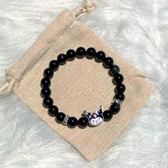 Brand New Handmade Kuromi Obsidian Beads Bracelet Standard Size 7 Inches Plus Stretch 7-8mm Semi-Precious Stones / Beads Silver Plated Crystal Spacers Fashion Character Charm Comes From A Smoke Free And Pet Free Home In California. Bundle & Save! Black Crystal Bracelet With Gemstone Beads As Gift, Silver Crystal Bracelet With Black Beads, Everyday Silver Jewelry With Black Beads, Obsidian Beaded Bracelets With Black Beads Gift, Obsidian Beaded Bracelets As Gift, Obsidian Round Beads Crystal Bracelet As Gift, Hand-strung Obsidian Beaded Bracelets As Gift, Handmade Black Crystal Bracelet Gift, Handmade Black Crystal Bracelet As Gift