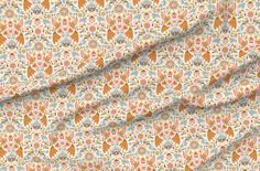 an orange and blue floral print fabric