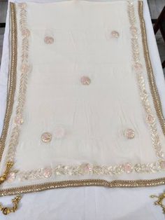 Item Overview ATHARVA Hand Embroidered/Indian Wedding Dupatta/Cream Off White Chiffon/Gota Work & Pink Thread Work/Tassels/Stole/Wrap/Sarong/Chunni/DUP24 ⚘Dno. DUP24 ⚘Hand Embroidered Gota Patti Dupatta/ Stole/ Scarf/Soft Chiffon Chinnon Dupatta ⚘Fabric Customisation: Options Available A. Net B. Organza C. Chiffon Chinnon D. Georgette E. Tabby Silk F. Pure Chiffon (Chamandi) ⚘Length: 2.5 Mtrs ⚘Width: 1.12 Mtrs ⚘Excusive Hand Embroidered Gota Patti Work ⚘Customization: * Fabrics: Designs Can be m Festive Off White Sheer Dupatta, Bollywood Style Off White Dupatta With Gota Work, Cream Georgette Traditional Wear With Sheer Dupatta, Cream Embroidered Saree With Traditional Drape, White Silk Traditional Wear With Embroidered Border, Traditional Cream Georgette Saree, Off White Dupatta With Gota Work For Festivals, Cream Georgette Saree With Traditional Drape, Cream Saree With Sheer Dupatta