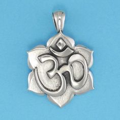 DESCRIPTION OM is the sacred sound of the universe. Chanting the OM during meditation positively impacts the mind and body. This elegant pendant will remind of that powerful feeling. Original design by Pat Frey 1 5/16 inch length. Type: Three Dimensional. Item Number: 1324 Spiritual Oxidized Flower Pendant Jewelry, Oxidized Pendant For Meditation, Oxidized Finish Pendant For Meditation, Holistic Handmade Jewelry For Yoga, Spiritual Oxidized Finish Jewelry For Meditation, Symbolic Oxidized Finish Necklace For Meditation, Symbolic Round Pendant Jewelry For Meditation, Spiritual Jewelry With Large Pendant, Spiritual Necklaces With Oxidized Finish For Meditation