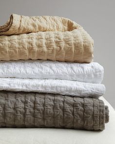 four blankets stacked on top of each other