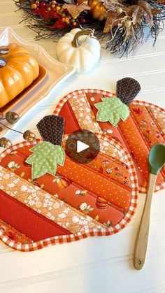 a table topped with lots of pumpkins and other decorations