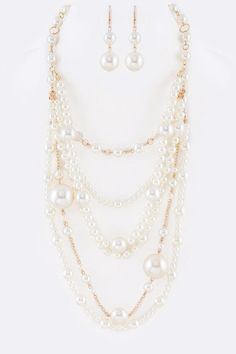 Mix Pearl Statement Layer Necklace Set Experience the elegance of layered pearls with this statement necklace set. This set includes multiple strands of pearls, creating a luxurious and classic look that will elevate any outfit. Made with high-quality materials, this necklace set is built to last and perfect for special occasions or adding a touch of sophistication to your everyday style.Necklace 1- 19" + ExtensionNecklace 2- 26"Earrings - 2.25" DropLead & Nickel Compliant Multi-strand Layered Pearl Necklace For Party, Multi-strand Layered Pearl Chain Necklace For Parties, Multi-strand Pearl Drop Necklaces For Party, White Multi-strand Layered Necklace With Pearl Chain, White Multi-strand Layered Pearl Necklace, Elegant Layered White Jewelry, Elegant Multi-strand Pearl Embellished Necklaces, Classic Multi-strand Pearl Necklace For Party, Pearl White Multi-strand Pearl Necklace