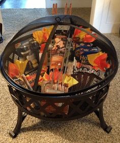 a coffee table made out of magazines and other items sitting on top of a carpeted floor